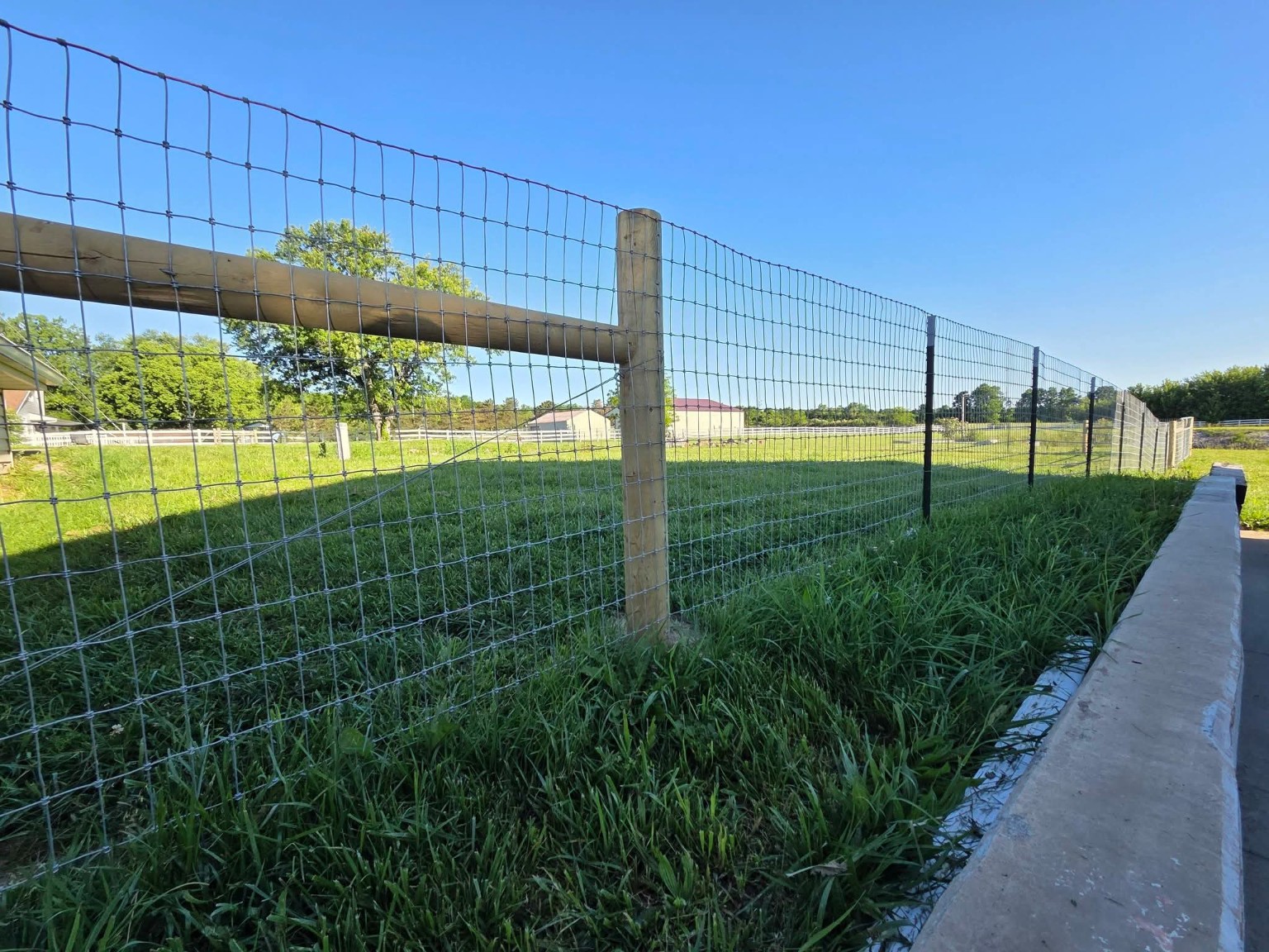 JC BANDIT post and wire fence project